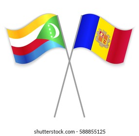 Comoran and Andorran crossed flags. Comoros combined with Andorra isolated on white. Language learning, international business or travel concept.