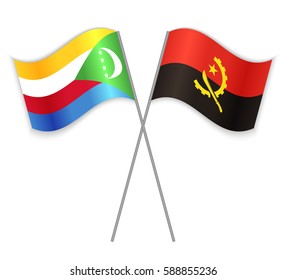 Comoran and Angolan crossed flags. Comoros combined with Angola isolated on white. Language learning, international business or travel concept.