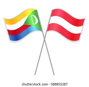 Comoran and Austrian crossed flags. Comoros combined with Austria isolated on white. Language learning, international business or travel concept.