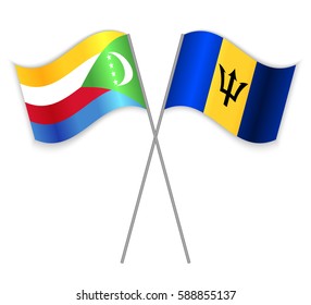 Comoran and Barbadian crossed flags. Comoros combined with Barbados isolated on white. Language learning, international business or travel concept.