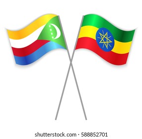 Comoran and Ethiopian crossed flags. Comoros combined with Ethiopia isolated on white. Language learning, international business or travel concept.