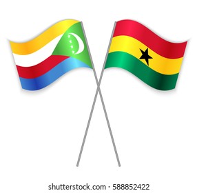 Comoran and Ghanaian crossed flags. Comoros combined with Ghana isolated on white. Language learning, international business or travel concept.