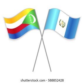Comoran and Guatemalan crossed flags. Comoros combined with Guatemala isolated on white. Language learning, international business or travel concept.