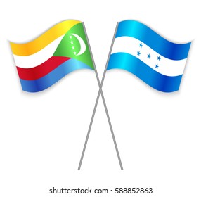 Comoran and Honduran crossed flags. Comoros combined with Honduras isolated on white. Language learning, international business or travel concept.