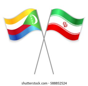 Comoran and Iranian crossed flags. Comoros combined with Iran isolated on white. Language learning, international business or travel concept.
