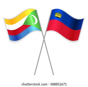 Comoran and Liechtenstein crossed flags. Comoros combined with Liechtenstein isolated on white. Language learning, international business or travel concept.