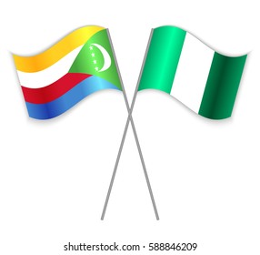 Comoran and Nigerian crossed flags. Comoros combined with Nigeria isolated on white. Language learning, international business or travel concept.