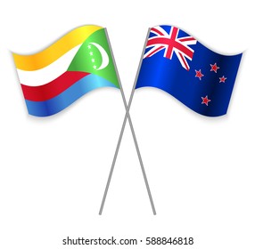 Comoran and NZ crossed flags. Comoros combined with New Zealand isolated on white. Language learning, international business or travel concept.