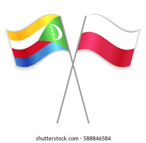 Comoran and Polish crossed flags. Comoros combined with Poland isolated on white. Language learning, international business or travel concept.