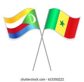 Comoran and Senegalese crossed flags. Comoros combined with Senegal isolated on white. Language learning, international business or travel concept.
