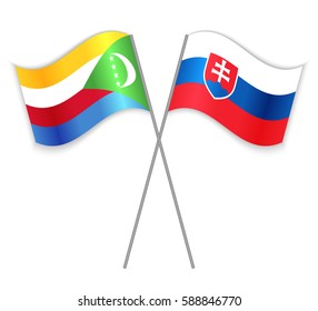 Comoran and Slovak crossed flags. Comoros combined with Slovakia isolated on white. Language learning, international business or travel concept.
