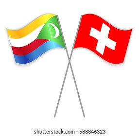 Comoran and Swiss crossed flags. Comoros combined with Switzerland isolated on white. Language learning, international business or travel concept.