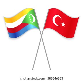 Comoran and Turkish crossed flags. Comoros combined with Turkey isolated on white. Language learning, international business or travel concept.