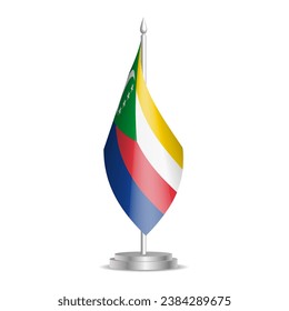 Bandera de las Comoras - mini bandera 3D colgada en el asta de escritorio. Se puede utilizar para la presentación en la cumbre o en la conferencia. Ilustración vectorial con sombreado.