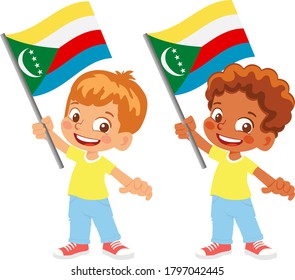 Comoros flag in hand. Children holding flag. National flag of Comoros vector