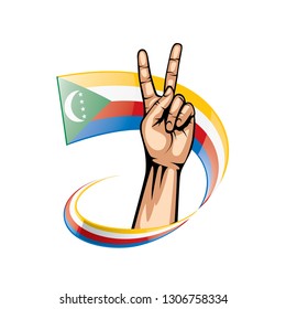 Comoros flag and hand on white background. Vector illustration
