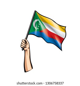 Comoros flag and hand on white background. Vector illustration