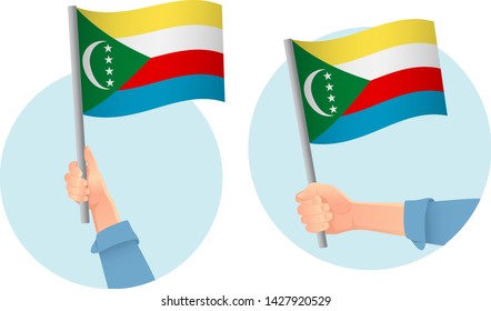 Comoros flag in hand. Patriotic background. National flag of Comoros vector illustration