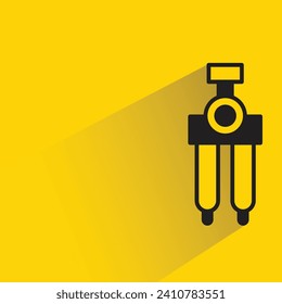 compass divider icon with shadow on yellow background