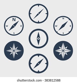 Compass flat icons set. Vector icons of a navigational compass in flat style. Windrose design elements. Compass pictogram. EPS8 clean vector illustration.