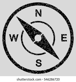 Compass grainy textured icon for overlay watermark stamps. Flat symbol with scratched texture. Dotted vector black ink rubber seal stamp with grunge design on a light gray background.