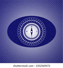 compass icon inside badge with jean texture