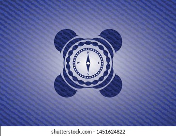 compass icon inside badge with jean texture