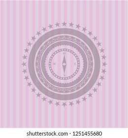 compass icon inside badge with pink background