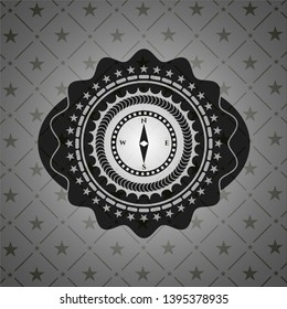 compass icon inside black emblem