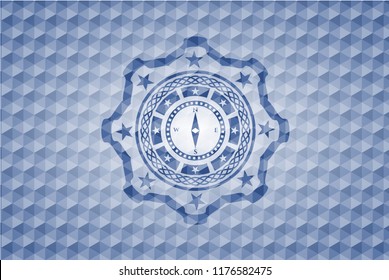 compass icon inside blue emblem or badge with abstract geometric pattern background.