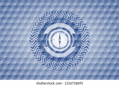 compass icon inside blue emblem with geometric pattern.