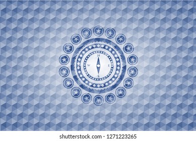 compass icon inside blue emblem or badge with abstract geometric pattern background.