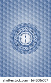 compass icon inside blue emblem or badge with abstract geometric pattern background.