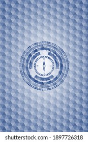 compass icon inside blue emblem or badge with geometric pattern background. 