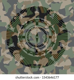 compass icon inside camouflage texture