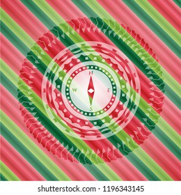 compass icon inside christmas colors style badge.