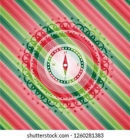 compass icon inside christmas colors badge.