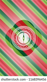 compass icon inside christmas emblem.
