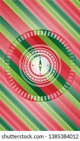 compass icon inside christmas style badge..