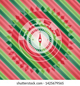 compass icon inside christmas style badge..