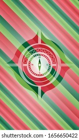 compass icon inside christmas style badge..