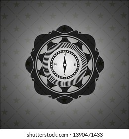 compass icon inside dark badge or emblem