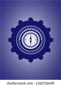 compass icon inside emblem with jean texture