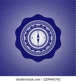 compass icon inside jean or denim emblem or badge background