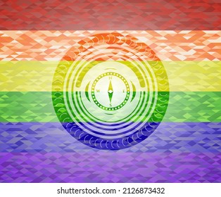 compass icon inside lgbt colors emblem. 