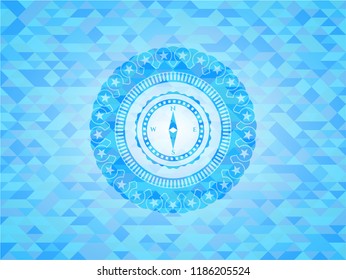 compass icon inside light blue emblem with mosaic background