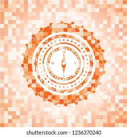 compass icon inside orange mosaic emblem with background