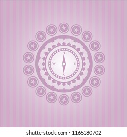 compass icon inside pink emblem