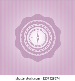 compass icon inside pink emblem