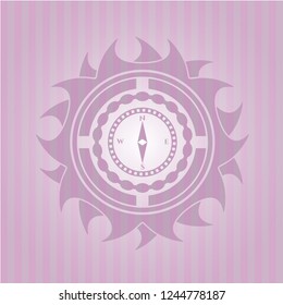 compass icon inside pink emblem